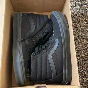 Never worn high top black vans in great condition